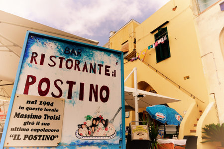 Ancient houses and boats on the island of Procida, Italian town of 10 434 inhabitants in the metropolitan city of Naples in Campania, August 2018, Italyのeditorial素材