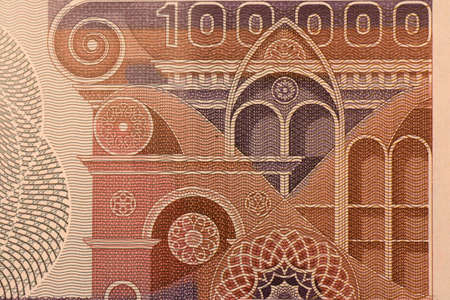 Ancient one hundred thousand Italian lira banknote, close-up view of ancient Italian buildings, Naples, March 2020のeditorial素材