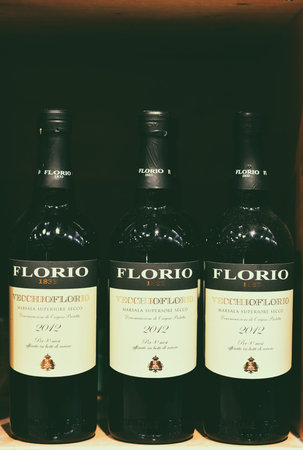 Famous bottles of Italian white and red wine, on sale in a supermarket, Milan, January 2020