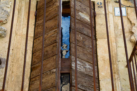 Wooden door, ancient stone houses in the historic center of Santo Stefano di Sessanio, Abruzzo, Italy, July 2019のeditorial素材