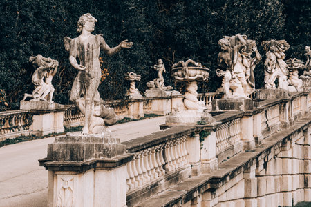 Statues and stone fountains in the large garden of the royal palace of Caserta, Italyのeditorial素材