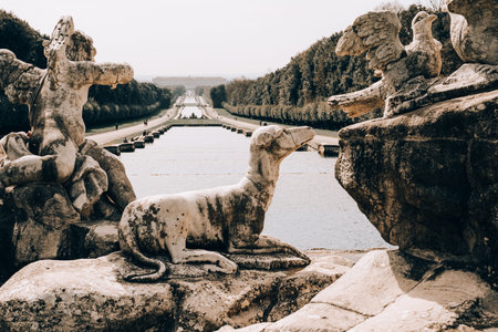 Statues and stone fountains in the large garden of the royal palace of Caserta, Italyのeditorial素材