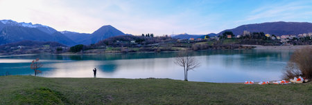 panoramic view of the lake and the village of Castel San Vincenzo, Molise, Italydの写真素材