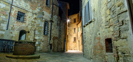 Panoramic view of the medieval city of Montepulciano at night, Italyの写真素材