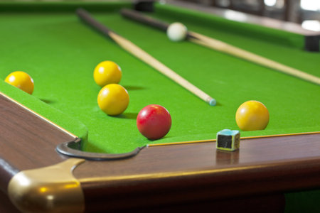 Pool game on green table