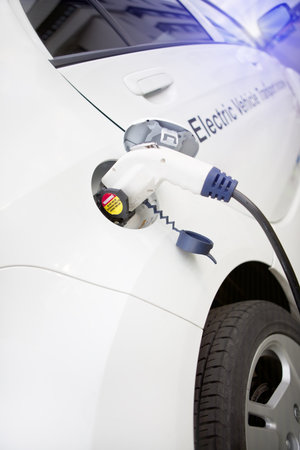 Cord hanging down from gas tank location on this electrical vehicle 