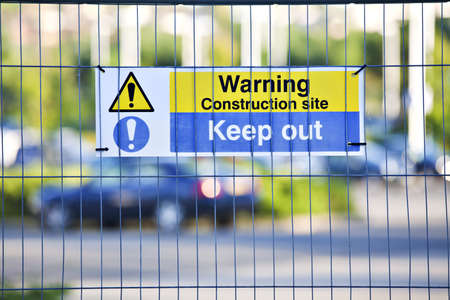 Warning, construction site. Keep Out sign on site fence. の写真素材