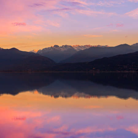 View over Lake Maggiore and Swiss Alps mountains from Italian side in Northern Italy.の写真素材
