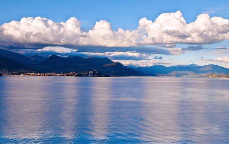 View over Lake Maggiore and Swiss Alps mountains from Italian side in Northern Italy.の写真素材