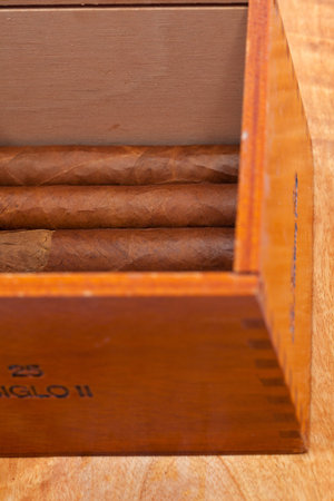 Genuine Cuban cigars and wooden varnished cigar boxの写真素材