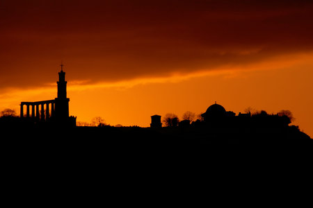 Silhouette of Edinburgh city skyline with dramatic sky backgroundの写真素材