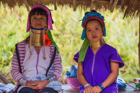 CHIANG RAI, THAILAND - JANUARY 2015: Unidentified Karen tribal old woman and girl near Mae Hong Son, Thailand, Chiang Rai. Padaung long neck hill tribe village, refugee community originate from neighboring Myanmar.のeditorial素材