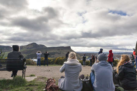 EDINBURGH-SCOTLAND, UK- MARCH 20 : Crowd gathered on Calton hill to witness unique phenomenon of the sun eclipse event on March 20, 2015.のeditorial素材