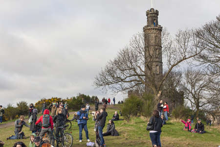 EDINBURGH-SCOTLAND, UK- MARCH 20 : Crowd gathered on Calton hill to witness unique phenomenon of the sun eclipse event on March 20, 2015.のeditorial素材