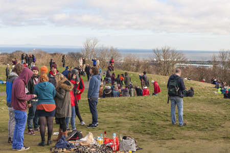 EDINBURGH-SCOTLAND, UK- MARCH 20 : Crowd gathered on Calton hill to witness unique phenomenon of the sun eclipse event on March 20, 2015.のeditorial素材