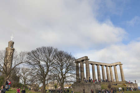 EDINBURGH-SCOTLAND, UK- MARCH 20 : Crowd gathered on Calton hill to witness unique phenomenon of the sun eclipse event on March 20, 2015.のeditorial素材