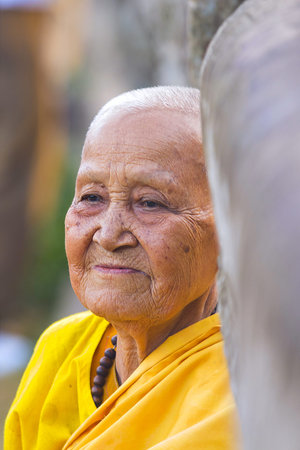 ANGKOR WAT, KRONG SIEM REAP, SIEM REAP, CAMBODIA-JANUARY 5, 2015: An unidentified old buddhist...
