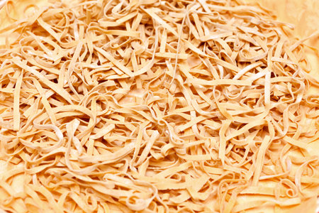Fresh home-made traditional fettuccine pasta ready for boilingの写真素材