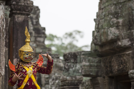 Hindu cultural legend of deity with hands gestures reenacting by an actor in colorful costume at...