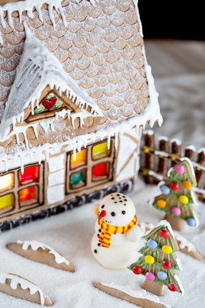 Decorative Christmas gingerbread house and snowmanの写真素材