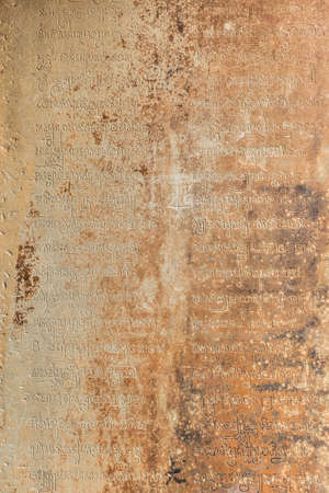 Sacred Khmer writing on a wall of Baksei Chamkrong Temple at Angkor Wat complex, Cambodiaの写真素材