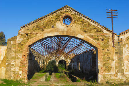 Ruins of abandoned loading bays for trucks and railway at Sao Domingos  mine in Alentejo, Portugal.の写真素材