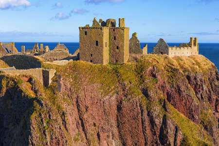 Dunnottar Castle is a ruined medieval fortress located upon a rocky headland on the north-east coast of Scotland, about 3 kilometres south of Stonehaven.の写真素材