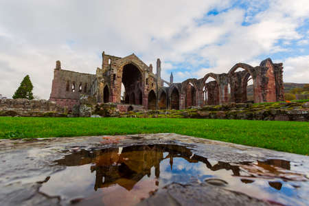 Ruins of Melrose Abbey in the Scottish Borders region in Scotland.の写真素材