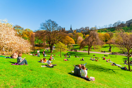 Edinburgh, Scotland, UK - April 18 2014: People relaxing and picnicking on a sunny warm spring day in Princes Street Gardens in Edinburgh, Scotland.のeditorial素材