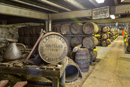ISLAY, SCOTLAND - SEPT 15 2017 : Old wooden barrels and casks at Lafroaig whisky distillery...