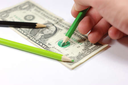 Man drawing a counterfeit bill.の写真素材