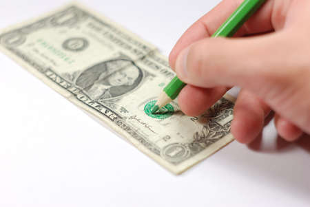 Man drawing a counterfeit bill.の写真素材