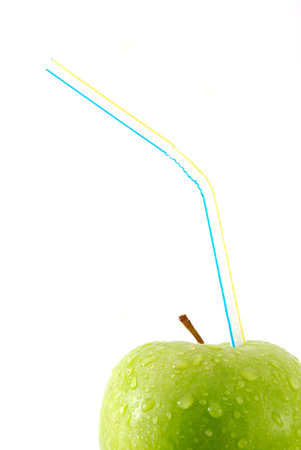 Green apple with strawの写真素材