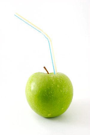 Green apple with strawの写真素材