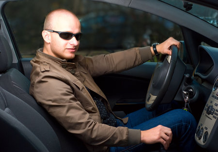 young man in a car
