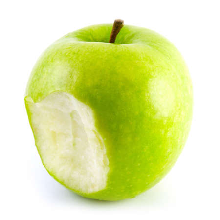 The bitten off green appleの写真素材