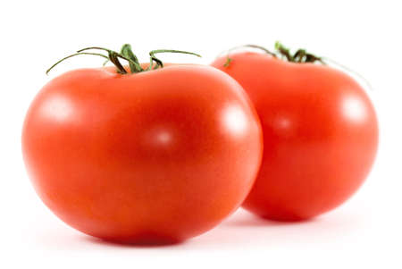 two tomatoes isolated on whiteの写真素材