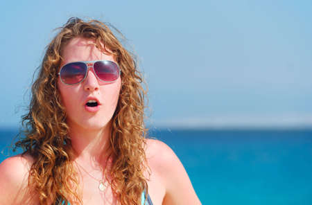 surprised woman near the seaの写真素材