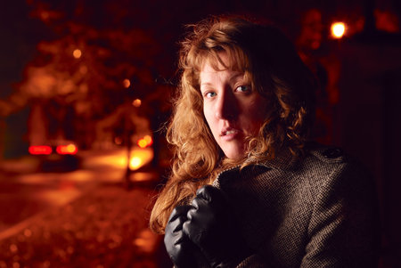 woman on a red night streetの写真素材