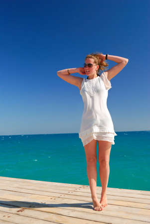 beautiful woman is enjoying the sea freedom
の写真素材