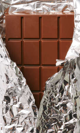 closeup of chocolate with foil wrappingの写真素材
