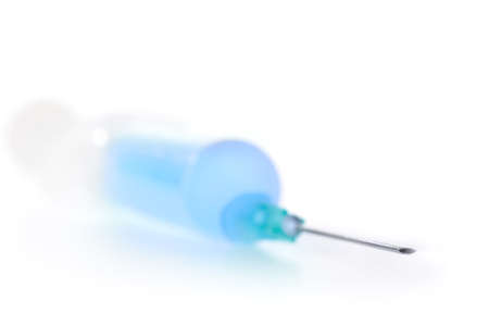 syringe with blue liquid isolated on whiteの写真素材