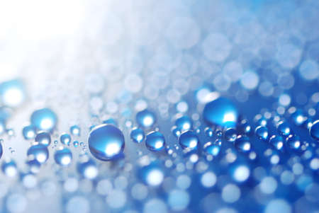 flying blue water dropsの写真素材