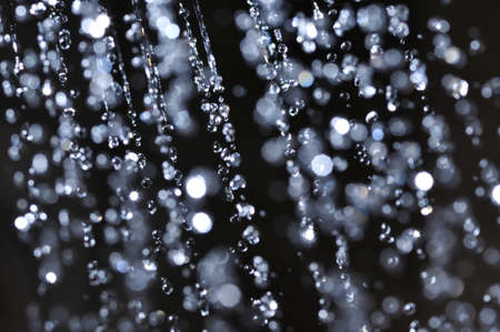 closeup view of water drops on black backgroundの写真素材