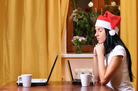 lonely pretty woman is waiting her friend at christmasの写真素材