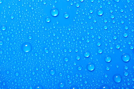 blue water drops on glassの写真素材