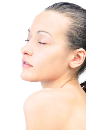 portrait of a sensual woman with closed eyes on white backgroundの写真素材