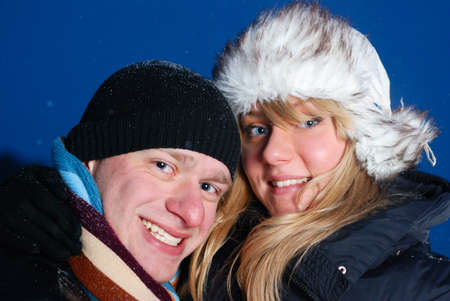 happy young couple at winter eveningの写真素材