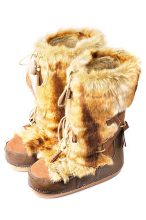 furry winter boots isolated on whiteの写真素材