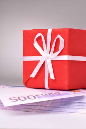 red gift box on the batch of euro notesの写真素材